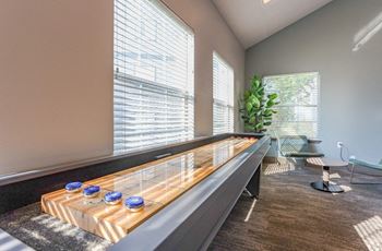 Game room with arcade game & shuffleboard
